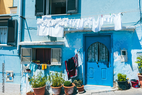 Fototapeta Naklejka Na Ścianę i Meble -  hanged clothes in italy procida italian summer