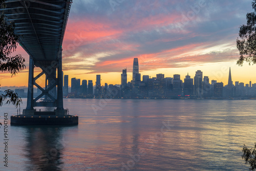 Vibrant Sunset as seen under the Bay Bridge with San Francisco Waterfront, via Yerba Buena Island, California, USA. photo