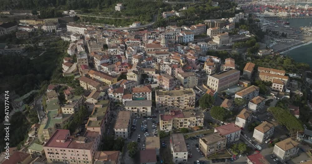 Aerial view of picturesque medieval town with charming rooftops and historic architecture along the coastline, Vietri sul Mare, Italy. Aerial view of picturesque medieval town with charming rooftops and historic architecture along the coastline, Vietri sul Mare, Italy.