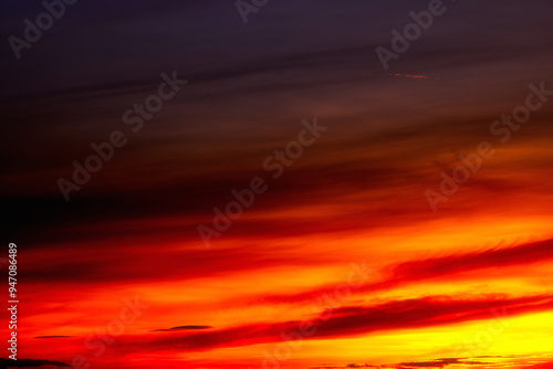 Beautiful colorful sky background in the morning with rising sun reflecting off the clouds creating a stunning and mesmerizing light effect.