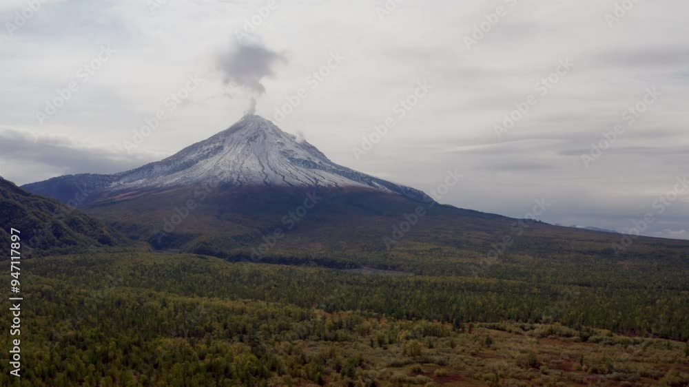 smoking volcano in the middle of the autumn forest smoking volcano in the middle of the autumn forest