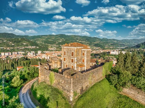 Obraz na płótnie Aerial view of Arzignano castle with medieval walled town, tall clock tower, fortified gates, turrets, towers, in the middle of a vineyard in Veneto Italy w salonie