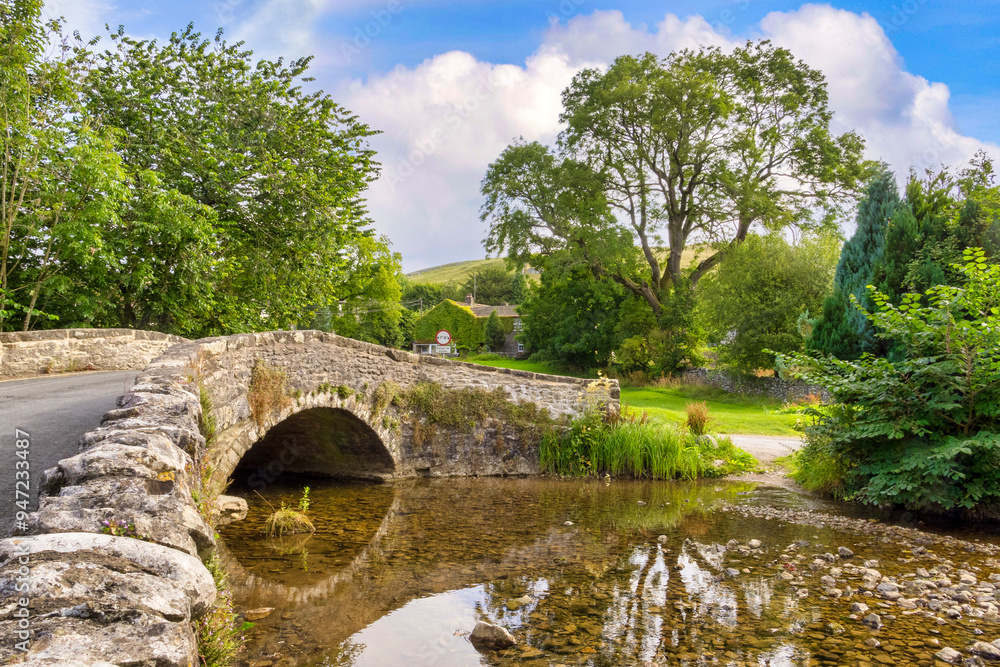 New Bridge, Malham, North Yorkshire - a humped bridge, originally a packhorse bridge, crossing Malham Beck. New Bridge, Malham, North Yorkshire - a humped bridge, originally a packhorse bridge, crossing Malham Beck.