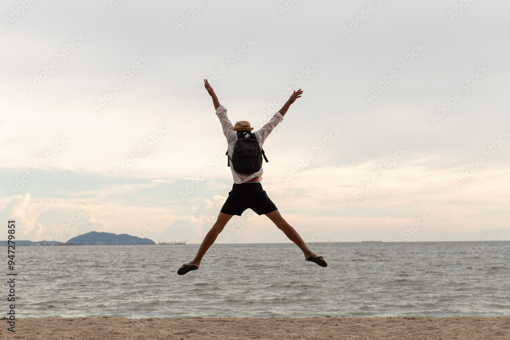 happy vacation on beach and traveler man jumping , happy freedom concept happy vacation on beach and traveler man jumping , happy freedom concept