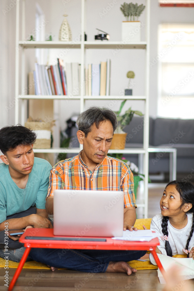 Portrait Of Father Telling Daughter And Son While Pointing At Laptop. Family Concept Portrait Of Father Telling Daughter And Son While Pointing At Laptop. Family Concept