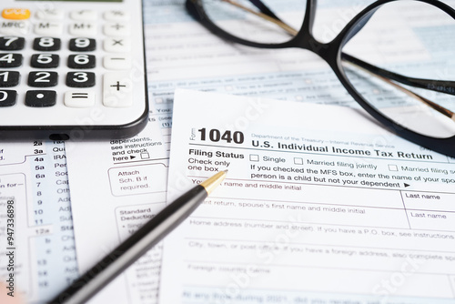 Tax form 1040 U.S. Individual Income Tax Return, business finance concept. photo