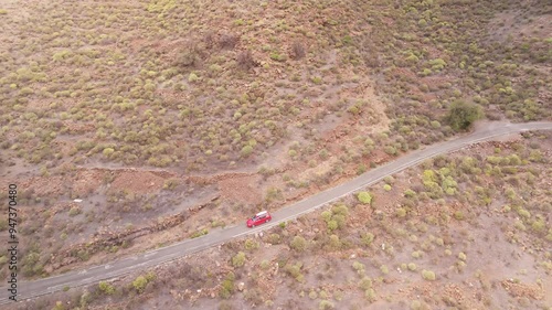 Aerial view of winding road through barren and arid landscape, El Toscon, Barranco de Siberio, Gran Canaria, Spain. photo