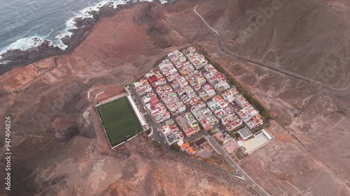 Aerial view of Las Coloradas Stadium surrounded by residential buildings and coastal hills, Las Palmas de Gran Canaria, Spain. photo