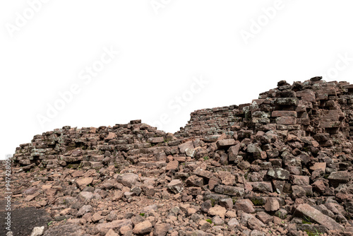 Ancient ruins. The remains of antique brick walls. Piles of old rotten stones on white background. photo