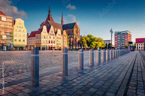 Attractive morning cityscape of Rostock town, Germany, Europe. Splendid summer view of St. Mary's Church on background. Traveling concept background. photo