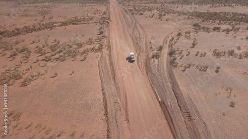 Aerial view of a remote dirt road in a vast arid desert landscape, Ernest Giles Road, Henbury Meteorites, Northern Territories, Australia. photo