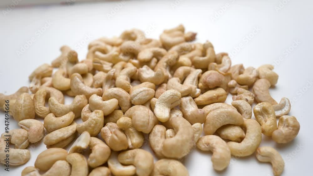 Fresh cashew nuts view in white background, close up of cashew nuts Fresh cashew nuts view in white background, close up of cashew nuts