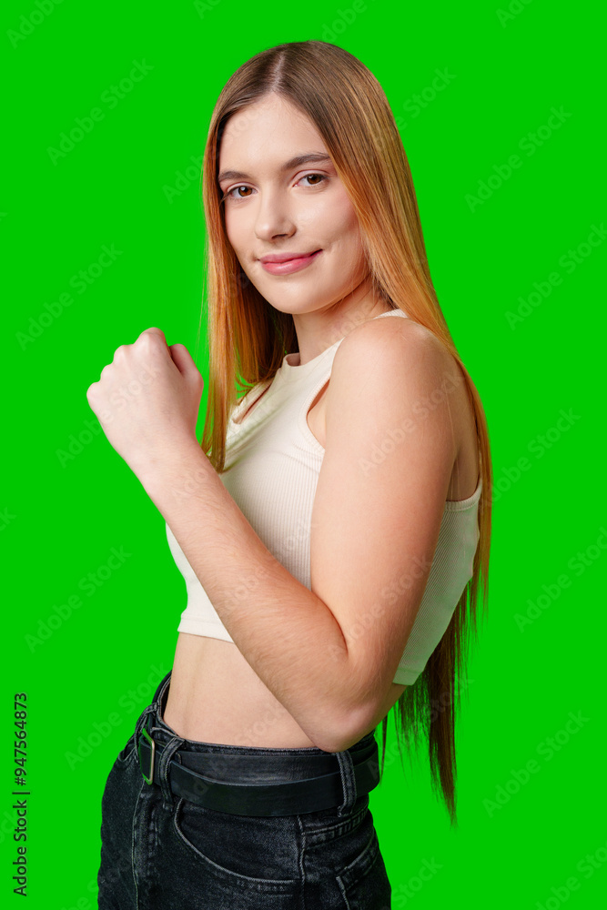 Young Woman Flexing Bicep Against Green Screen Young Woman Flexing Bicep Against Green Screen