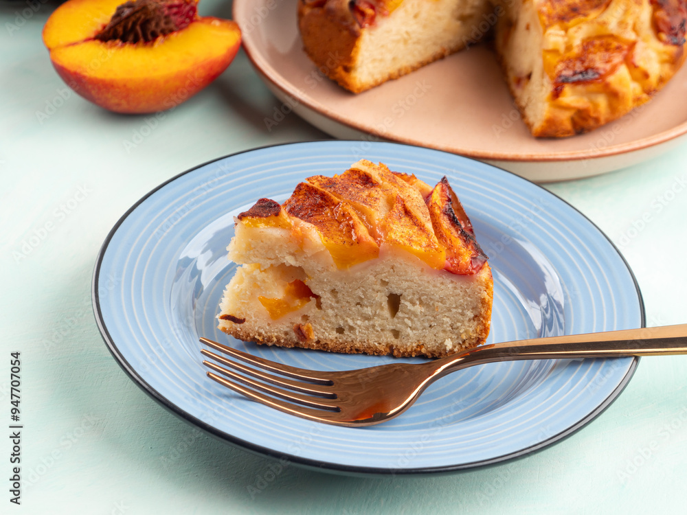 Vegan nectarine peach cake on turquoise table, summer treat Vegan nectarine peach cake on turquoise table, summer treat