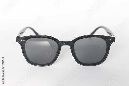 Foto Stylish black sunglasses isolated on white background.
