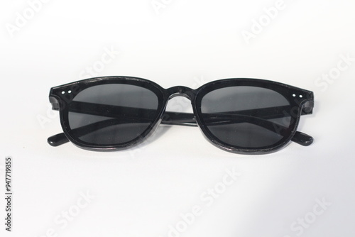 Stylish black sunglasses isolated on white background. photo