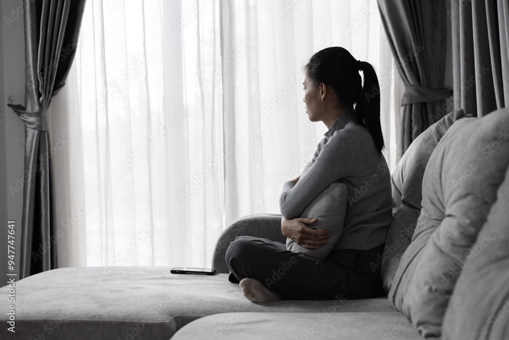 Depressed woman, person sitting alone on the sofa felling sad worry. Stress, suicidal thoughts. Depressed woman, person sitting alone on the sofa felling sad worry. Stress, suicidal thoughts.