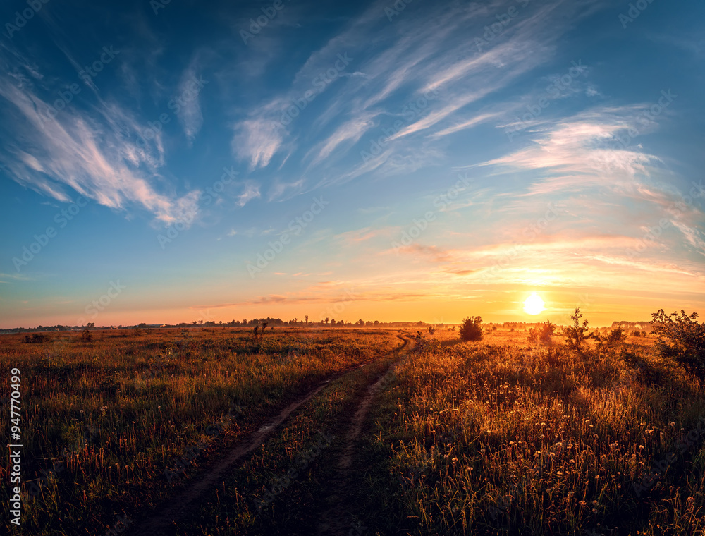 Rural landscape with road of sunrise over the field on the summer morning. Rural landscape with road of sunrise over the field on the summer morning.