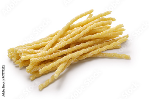 A type of Italian pasta called Busiate, which is made by twisting long, thick noodles around a knitting needle. photo