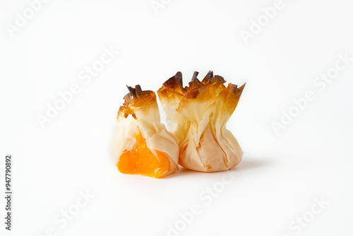 Traditional Portuguese sweets with egg cream - tulhinhas on white background photo