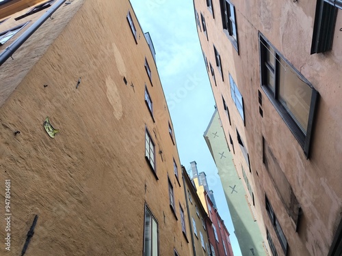 Photography A street lined with colorful houses in Stockholm's historic Gamla Stan district,