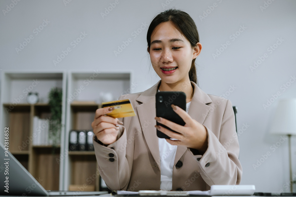 woman hand holding laptop, tablet and using credit card for online shopping.Online shopping concept. woman hand holding laptop, tablet and using credit card for online shopping.Online shopping concept.