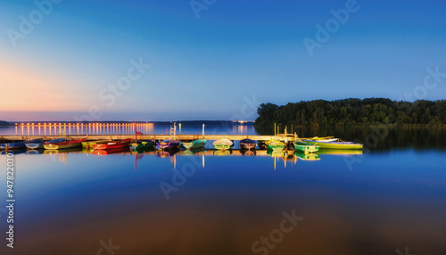 Photography boat on the lake at sunset