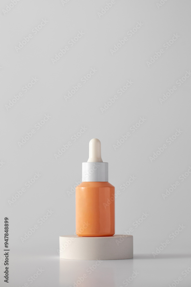 Dropper with anti-aging serum on the podium. Cosmetics, skin care. Dropper with anti-aging serum on the podium. Cosmetics, skin care.