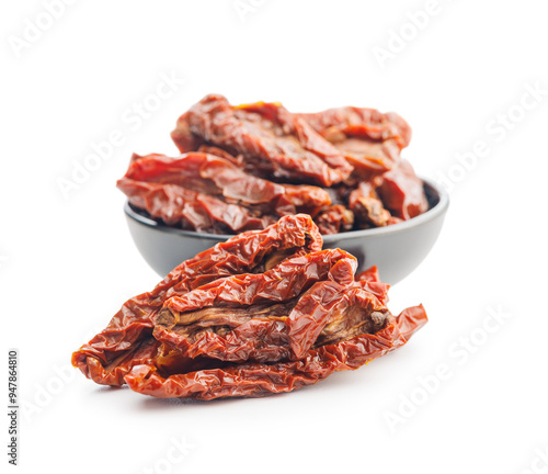 Sun dried red tomatoes isolated on white background.