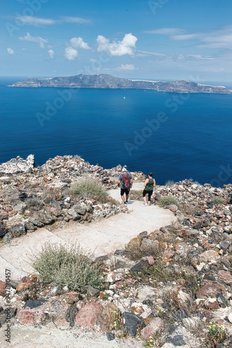 View of Skaros rock, a rocky headland that protrudes out to the azure blue Aegean Sea, Imerovigli, Santorini, Greece. This was on a hot sunny afternoon. photo