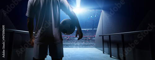 Soccer player's  waiting in a stadium tunnel  with  soccer ball before match. Background is an imaginary stadium that is modelled and rendered.