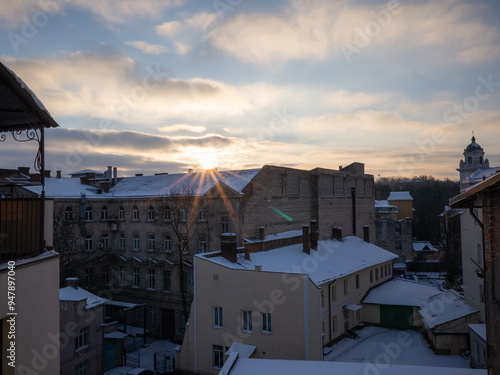 winter scenery with snow covered buildings in lviv old city photo