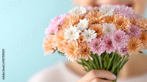 An woman with clear skin, smiling while holding a bouquet of flowers, symbolizing natural beauty