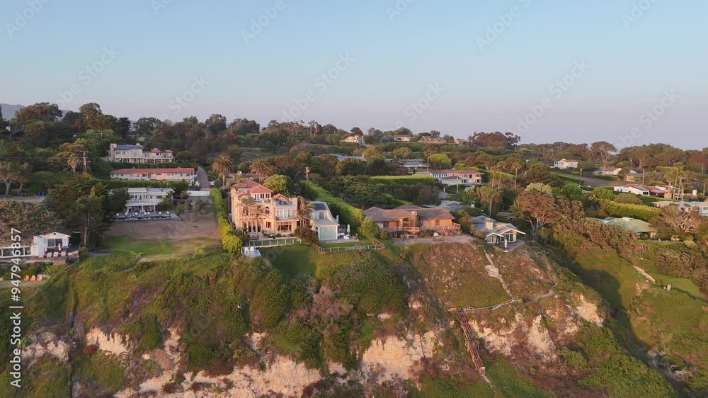 Golden hour aerial rotates over prominent estates at Malibu Beach, CA Golden hour aerial rotates over prominent estates at Malibu Beach, CA