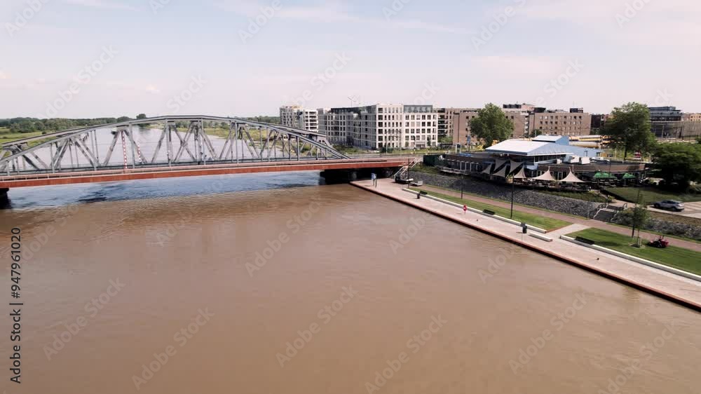 Aerial pan showing infrastructure at river IJssel with IJsselkade boulevard of tower town Zutphen urban development Aerial pan showing infrastructure at river IJssel with IJsselkade boulevard of tower town Zutphen urban development