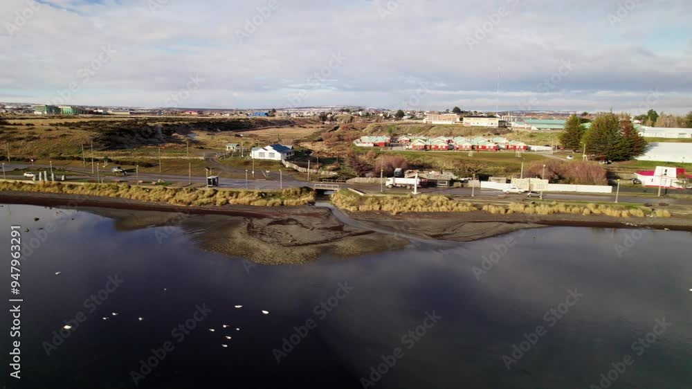 Aerial pan over a reflective lake near the small town of Puerto Natales in Patagonia, Chile. Aerial pan over a reflective lake near the small town of Puerto Natales in Patagonia, Chile.