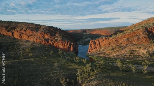 Cinematic aerial of morning light hitting gorge in Arrernte country Australia photo