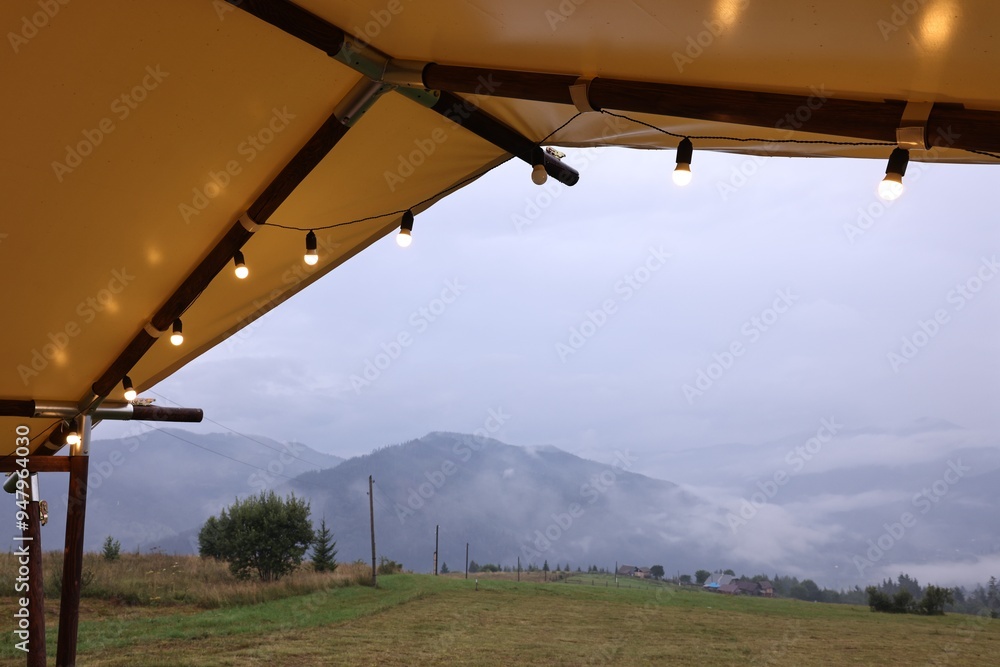 Roof of building with decorative lights in mountains Roof of building with decorative lights in mountains