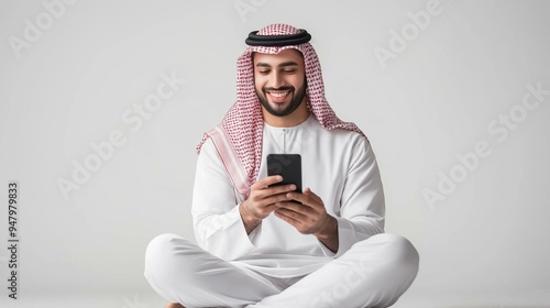 Arab businessman using a mobile isolated background