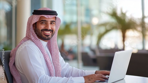 Arab businessman using a laptop photo