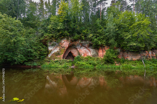 Angel’s Cave (latvian: Eņģeļu ala) on Salaca river, Mazsalaca, Latvia at summer