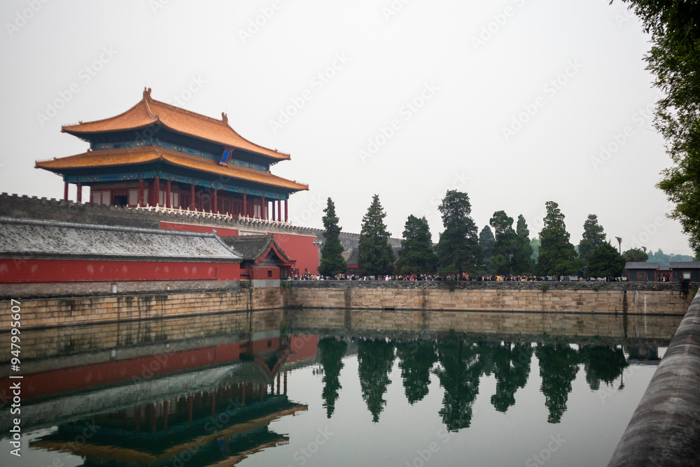 A Tranquil View of the Forbidden City Reflecting in the Still Waters of Its Moat During a Hazy Afternoon in Beijing A Tranquil View of the Forbidden City Reflecting in the Still Waters of Its Moat During a Hazy Afternoon in Beijing