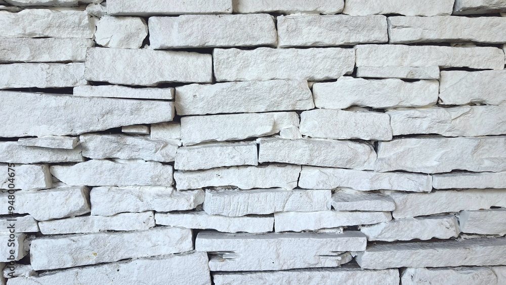 Obraz premium White brick wall texture background. Exterior rock brick wall. Close up of a white brick-wall.