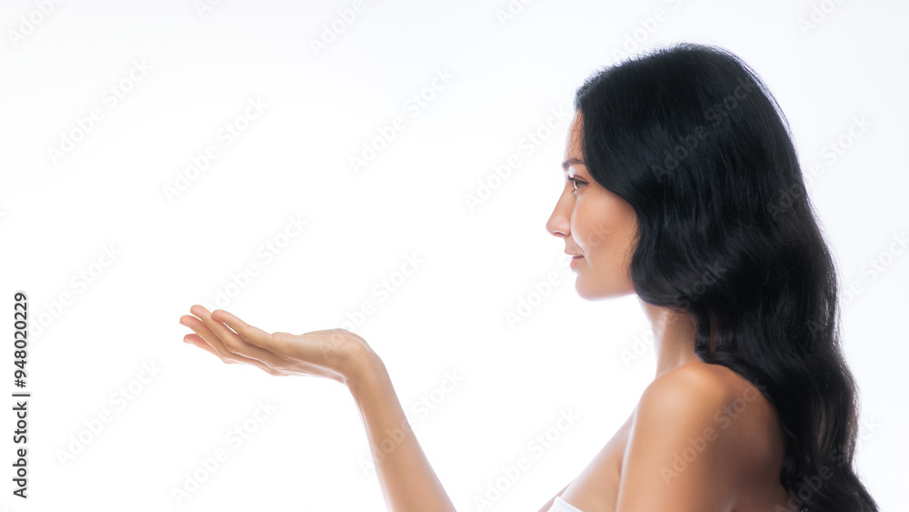 Profile View of Smiling Woman Presenting Product with Copy Space Profile View of Smiling Woman Presenting Product with Copy Space
