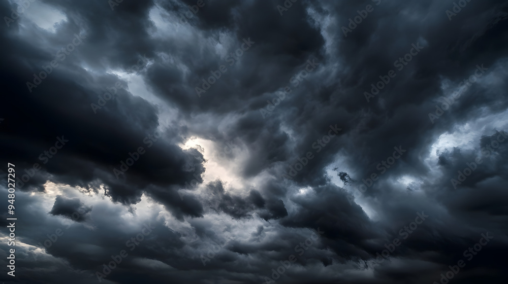dark dramatic sky with black stormy clouds before rain or snow as abstract background, extreme weather, the sun shines through the clouds, high contrast photo dark dramatic sky with black stormy clouds before rain or snow as abstract background, extreme weather, the sun shines through the clouds, high contrast photo