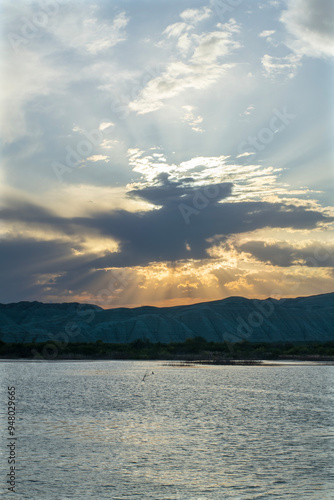 Sunset view by the lake in the evening. Sunset over the lake in the evening. Sunset from the campsite in the evening.