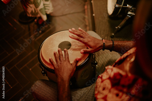 Tableau sur toile High angle view of unrecognizable man playing conga in Afro-Cuban jazz band