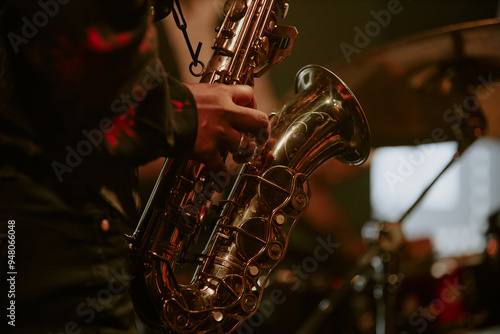 Photography Medium closeup of unrecognizable Black jazz musician playing saxophone on stage