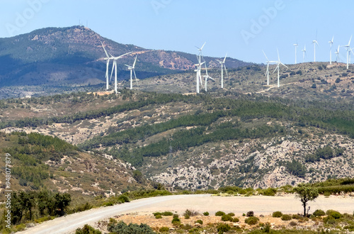 Wind turbine in mountains. Eolic park windpower. Wind farm or New Wind green energy. Wind turbines alternative energy. Windmill power clean electricity generation in Viver, Castellón, Caudiel, Spain photo