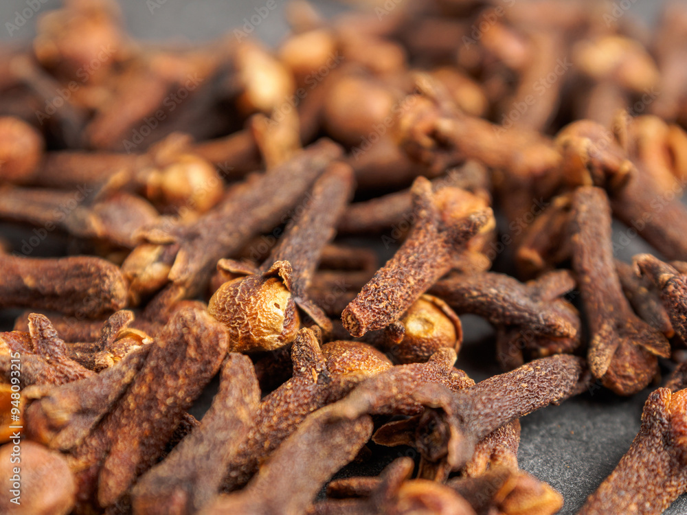 A close-up of aromatic cloves, highlighting the texture and rich color A close-up of aromatic cloves, highlighting the texture and rich color